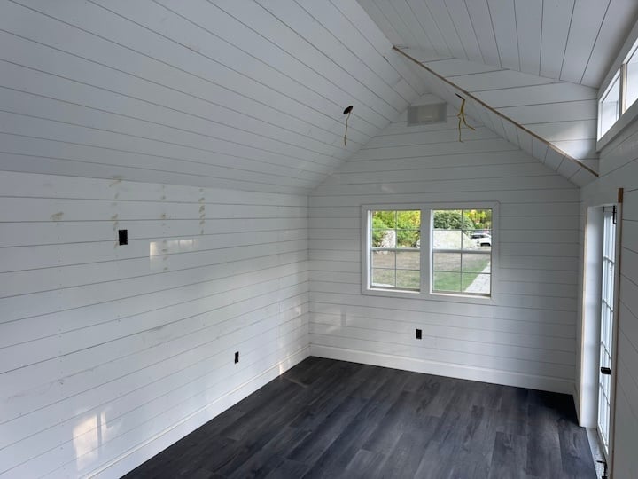 Primed Shiplap and Lifeproof Flooring Poolhouse by Reilly Brothers Construction