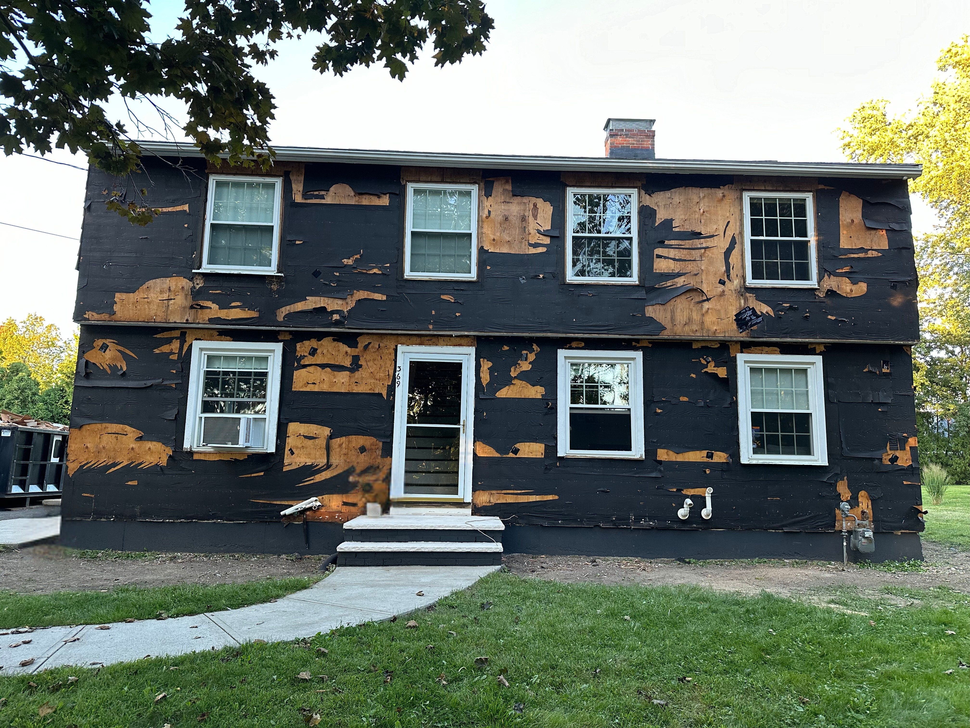 White Colonial All Siding Removed - Reilly Brothers Construction